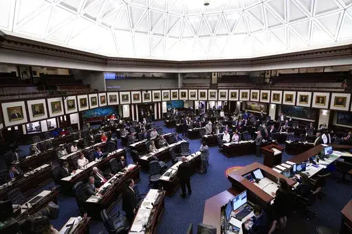 Members of the Florida House of Representatives convene during a legislative session April 30, 2021, at the Capitol in Tallahassee, Fla. On Tuesday, Feb. 22, 2022, Florida House Republicans advanced a bill, dubbed by opponents as the “Don’t Say Gay” bill, to forbid discussions of sexual orientation and gender identity in schools, rejecting criticism from Democrats who said the proposal demonizes LGBTQ people. (AP Photo/Wilfredo Lee, File)