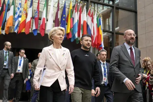 From left, European Commission President Ursula von der Leyen, Ukraine's President Volodymyr Zelenskyy and European Council President Charles Michel walk together during an EU summit in Brussels on Feb. 9, 2023. The European Union decided Thursday, Dec. 14, 2023 to open accession negotiations with Ukraine, a stunning reversal for a country at war that had struggled to find the necessary backing for its membership aspirations and long faced opposition from Hungarian Prime Minister Viktor Orban. (