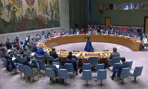 The United Nations Security Council listens to comments during a meeting, Friday, March 11, 2022, at UN headquarters. The Russian request for the Security Council meeting followed a U.S. rejection of Russian accusations that Ukraine is operating chemical and biological labs with U.S. support. (UNTV via AP)