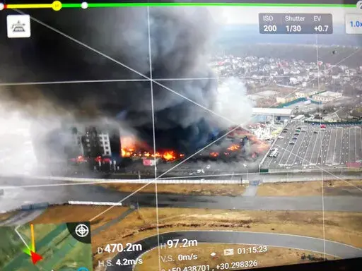 This 2022 aerial image provided by Ukrainian security forces, taken by a drone and shown on a screen, shows a blown-up building near the outskirts of Kyiv, Ukraine. The exact date and time of the image are unknown. In better times, Ukrainian drone enthusiasts flew their gadgets into the sky to photograph weddings, fertilize soybean fields or race other drones for fun. Now some are risking their lives by forming a volunteer drone force to help their country repel the Russian invasion.   (Ukrainia