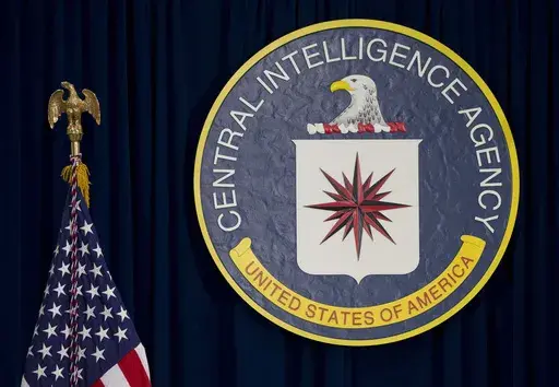 This April 13, 2016 file photo shows the seal of the Central Intelligence Agency at its headquarters in Langley, Va. In February 2024, the CIA terminated a woman whose whistleblower account of being assaulted in a stairwell at the spy agency's headquarters prompted a flood of her colleagues to come forward with their own complaints of sexual misconduct. The woman's attorney called the action a brazen retaliation. (AP Photo/Carolyn Kaster, File)