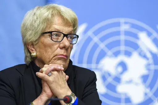FILE- Carla del Ponte, then Member of the Independent Commission of Inquiry on the Syrian Arab Republic, attends a press conference, at the European headquarters of the United Nations in Geneva, Switzerland, Wednesday, March 1, 2017. The former chief prosecutor of the International Criminal Court has called for an international arrest warrant to be issued for Russian President Vladimir Putin. “Putin is a war criminal,” Carla Del Ponte told Swiss newspaper Le Temps in an interview published S