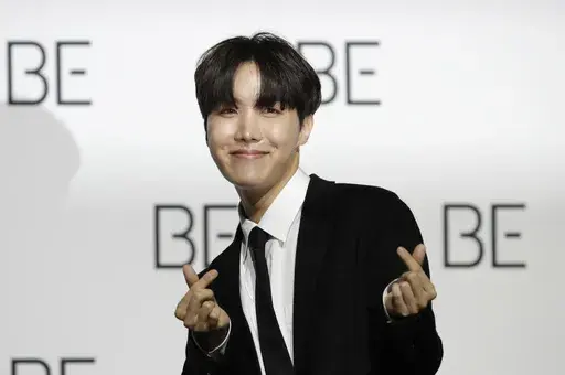 A member of South Korean K-pop band BTS J-Hope poses for photographers during a press conference to introduce their new album "BE" in Seoul, South Korea, Nov. 20, 2020. J-Hope entered a South Korean boot camp Tuesday, April 18, 2023 to start his 18-month compulsory military service, becoming the group’s second member to join the country's army. (AP Photo/Lee Jin-man, File)