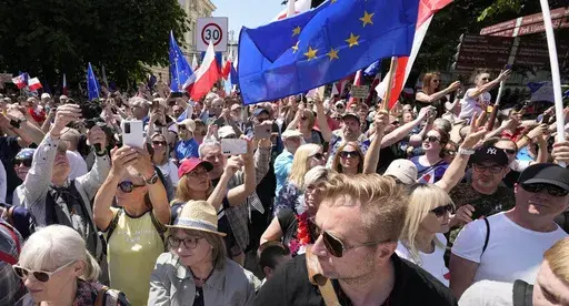 Participants join an anti-government march led by the centrist opposition party leader Donald Tusk, who along with other critics accuses the government of eroding democracy, in Warsaw, Poland, Sunday, June 4, 2023. Poland's largest opposition party led a march Sunday meant to mobilize voters against the right-wing government, which it accuses of eroding democracy and following Hungary and Turkey down the path to autocracy. The march is being held on the 34th anniversary of the first partly free 