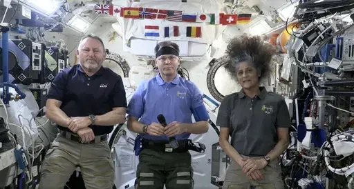This image taken from video posted by NASA shows, from left, Butch Wilmore, Nick Hague and Suni Williams speaking during a news conference, Tuesday, March 4, 2025. (NASA via AP)