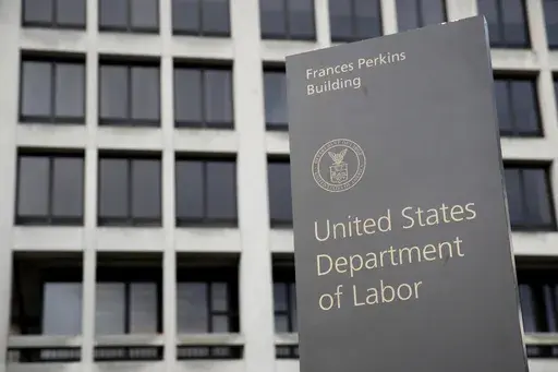 A sign stands outside the U.S. Department of Labor's headquarters, May 6, 2020, in Washington. The U.S. Department of Labor’s Occupational Safety and Health Administration found numerous safety violations in its investigation of the July 2023 workplace accident that caused the death of Duvan Pérez, a Guatemalan teenager who had been a contract worker at the Mar-Jac Poultry plant in Hattiesburg, Miss., the agency said in a news release on Tuesday, Jan. 16, 2024. (AP Photo/Patrick Semansky, Fil