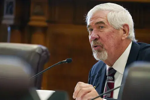 Mississippi Senate Medicaid Committee Chairman Kevin Blackwell, R-Southaven, asks a question of Dr. Anita Henderson, president of the Mississippi Chapter of the American Academy of Pediatrics, during a hearing, Dec. 1, 2022, at the state Capitol in Jackson, Miss. Mississippi state senators passed a bill on Tuesday, Feb. 7, 2023, that would let mothers keep Medicaid coverage for a year after giving birth, up from the current two months. (AP Photo/Rogelio V. Solis, File)