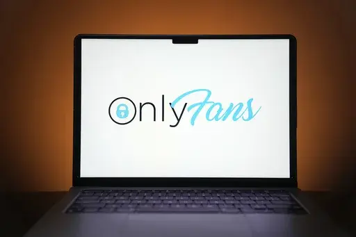 The OnlyFans logo is seen on a computer monitor in this posed photo, Thursday, Dec. 7, 2023, in St. Louis. The site and others like it provide an opportunity for those willing to dabble in pornography to earn extra money, including two teachers at the same Missouri high school. (AP Photo/Jeff Roberson)