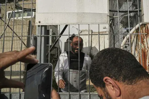 Hamdan Ballal, Oscar-winning Palestinian director of "No Other Land," is released from a police station in the West Bank settlement of Kiryat Arba a day after being detained by the Israeli army following an attack by Jewish settlers, March 25, 2025. (AP Photo/Leo Correa)