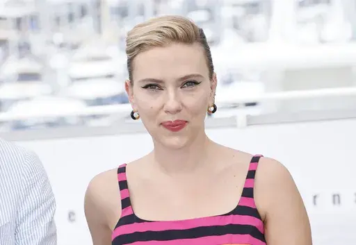 Scarlett Johansson poses for photographers at the photo call for the film "Asteroid City" at the 76th international film festival, Cannes, southern France, May 24, 2023. OpenAI plans to halt the use of one of its ChatGPT voices after some drew similarities to Johansson, who famously portrayed a fictional AI assistant in the (perhaps no longer so futuristic) film “Her.” (Photo by Joel C Ryan/Invision/AP, File)