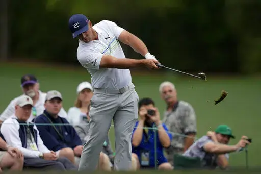 Bryson DeChambeau hits on the 12th tee during a practice round for the Masters golf tournament on Wednesday, April 6, 2022, in Augusta, Ga. (AP Photo/Matt Slocum)