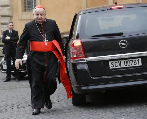 Cardinal Stanislaw Dziwisz arrives for a meeting at the Vatican, Friday, March 8, 2013. A Vatican investigation into allegations that Dziwisz, the former top aide to St. John Paul II was negligent in handling sex abuse claims in his native Poland has cleared him of wrongdoing, the Vatican’s embassy in Poland said Friday, April 22, 2022. (AP Photo/Alessandra Tarantino, File)