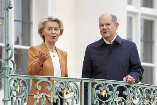 German Chancellor Olaf Scholz, right, welcomes European Commission President Ursula von der Leyen, left, for a meeting as part of a two-day closed meeting of the German government at Meseberg palace in Gransee near Berlin, Germany, Sunday, March 5, 2023. (AP Photo/Michael Sohn)