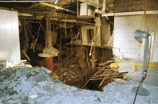 The crater in an underground parking garage from the World Trade Center explosion is shown in this Feb. 27, 1993 photo. New York City is marking the anniversary of the 1993 bombing that blew apart a van parked in an underground garage, killing six people and injured more than 1,000. The Port Authority of New York and New Jersey is holding a memorial Mass on Monday, Feb. 26, 2024 at St. Peter’s Church in Manhattan. (AP Photo/Richard Drew, file)