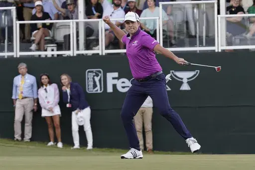 Luke List skips as he sinks a 43-foot putt for birdie on No. 18 to win the Sanderson Farms Championship golf tournament Sunday, Oct. 8, 2023, in Jackson, Miss. (AP Photo/Rogelio V. Solis)
