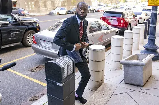 Prakazrel "Pras" Michel, a member of the 1990s hip-hop group the Fugees arrives at federal court for his trial in an alleged campaign finance conspiracy, Monday, April 3, 2023, in Washington. (AP Photo/Andrew Harnik)