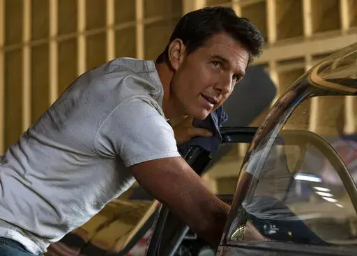 This image released by Paramount Pictures shows Tom Cruise portraying Capt. Pete "Maverick" Mitchell in a scene from "Top Gun: Maverick."  Paramount Pictures announced Tuesday that “Top Gun: Maverick,” having made more than $1.48 billion worldwide at the box office, will debut Dec. 22 on Paramount+.  (Scott Garfield/Paramount Pictures via AP)