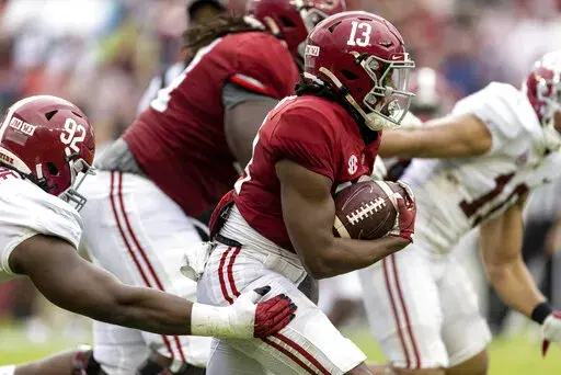 Alabama running back Jahmyr Gibbs (13) runs the ball during the first half of Alabama's A-Day NCAA college football scrimmage, Saturday, April 16, 2022, in Tuscaloosa, Ala. (AP Photo/Vasha Hunt)