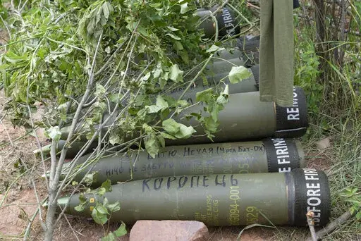 U.S.-supplied M777 howitzer shells lie on the ground to fire at Russian positions in Ukraine's eastern Donbas region June 18, 2022. The intense firefight over Ukraine has the Pentagon rethinking its weapons stockpiles. If another major war broke out today, would the U.S. have enough ammunition to fight? It’s a question Pentagon planners are grappling with not only as the look to supply Ukraine for a war that could stretch for years, but also as they look to a potential conflict with China. (AP