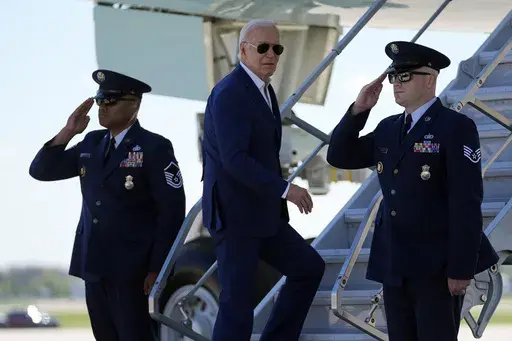 President Joe Biden boards Air Force One as he departs Milwaukee Mitchell International Airport, Wednesday, May 8, 2024, in Milwaukee. (AP Photo/Evan Vucci)