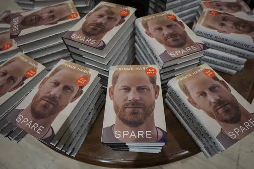 Copies of the new book by Prince Harry called "Spare" are displayed at a book store in London, Jan. 10, 2023. Prince Harry’s explosive memoir, with its damning allegations of a toxic relationship between the monarchy and the press, is likely to accelerate the pace of change already under way within the House of Windsor following the death of Queen Elizabeth II. (AP Photo/Kin Cheung, File)