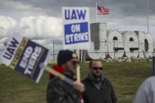 Striking UAW workers picket at the Jeep Assembly Plant on Oct. 9, 2023 in Toledo, Ohio. The UAW contends that the furloughs by Detroit's three automakers were not necessary and are being done in an effort to push members to accept less in contract negotiations. (Jonathan Aguilar/The Blade via AP, File)