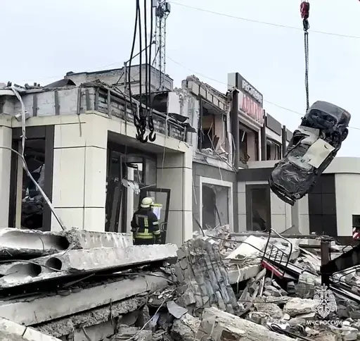 In this photo taken from video released by Russian Emergency Ministry Press Service on Saturday, Feb. 3, 2024, Russian Emergency Ministry employees work at the side of a collapsed bakery after an attack of Ukrainian troops, that Russian officials in Luhansk said was conducted by Ukrainian forces, in Lysychansk, Russian-controlled Luhansk region, eastern Ukraine. According to the Russian Emergency Ministry, five people were found dead under the rubble. Eight people were injured and there might be