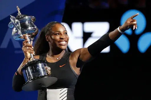 United States' Serena Williams holds her trophy after defeating her sister, Venus, during the women's singles final at the Australian Open tennis championships in Melbourne, Australia, Jan. 28, 2017. Williams famously won the tournament when she was eight weeks pregnant. An expert said mothers often are better athletes because they learn how to manage their time better, they understand their bodies better and they may be peaking even later in life. (AP Photo/Dita Alangkara, File)