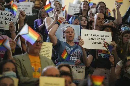 LGBTQ+ activists protest Senate Bill 14, that would ban gender-affirming medical care for transgender children, at the Texas Capitol, Friday, May 12, 2023, in Austin, Texas. The Texas Supreme Court has upheld the state’s ban on gender-affirming medical care for minors, Friday, June 28, 2024, rejecting pleas from parents that it violates their right to seek care for their transgender children. (Mikala Compton/Austin American-Statesman via AP, File)