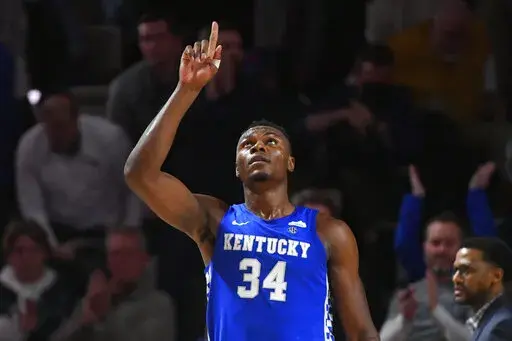 Kentucky forward Oscar Tshiebwe (34) as after an NCAA college basketball game against Vanderbilt comes to an end, Tuesday, Jan. 11, 2022, in Nashville, Tenn. Kentucky won 78-66. (AP Photo/John Amis)
