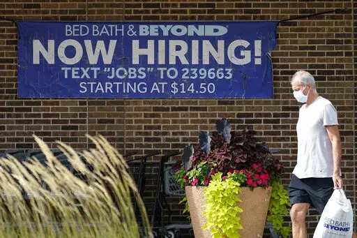 Hiring sign is displayed in Deerfield, Ill., Wednesday, Sept. 21, 2022.  Labor Department releases weekly report on unemployment benefits on Thursday, Nov. 10. (AP Photo/Nam Y. Huh)