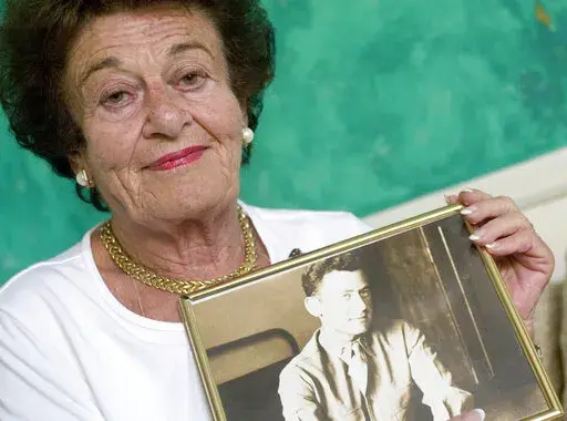 Gerda Weissmann Klein holds a picture of her late husband, Kurt Klein, the U.S. soldier who rescued her from the Holocaust, at her home in Scottsdale, Ariz., on Aug. 24, 2005. Weissmann Klein, a Holocaust survivor and author who wrote about her ordeal and went on to receive the Presidential Medal of Freedom, will be remembered at a memorial May 1 after her death in Phoenix earlier this month. Klein died April 3, 2022 in Phoenix, where she had lived since 1985. She was 97. (Pat Shannahan/The Ariz
