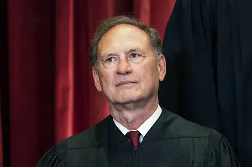 Associate Justice Samuel Alito sits during a group photo at the Supreme Court in Washington, April 23, 2021. The Supreme Court has ended constitutional protections for abortion that had been in place nearly 50 years — a decision by its conservative majority to overturn the court's landmark abortion cases. (Erin Schaff/The New York Times via AP, Pool, File)