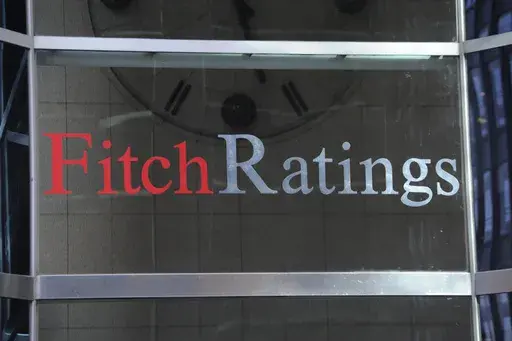 This photo shows signage for Fitch Ratings, Sunday, Oct. 9, 2011, in New York. On Tuesday, Aug. 1, 2023, Fitch Ratings has downgraded the U.S. credit rating, citing an expected increase in government debt over the next three years and a “steady deterioration in standards of governance” over the past two decades. (AP Photo/Henny Ray Abrams, File)