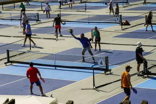 People practice pickleball on the courts of CityPickle at Central Park's Wollman Rink, Saturday, Aug. 24, 2024, in New York. (AP Photo/Eduardo Munoz Alvarez)