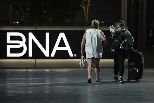 Air travelers make their way through the Nashville International Airport Tuesday, July 25, 2023 in Nashville, Tenn. A new Tennessee law that installs a state takeover of the board that oversees Nashville's airport has created confusion about who is actually running the facility. (AP Photo/George Walker IV)