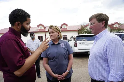 Deanne Criswell, administrator of the Federal Emergency Management Agency (FEMA), center, and Mississippi Gov. Tate Reeves, right, confer with Jackson Mayor Chokwe Antar Lumumba following a tour the City of Jackson's O.B. Curtis Water Treatment Facility in Ridgeland, Miss., Sept. 2, 2022. Jackson's water system partially failed following flooding and heavy rainfall that exacerbated longstanding problems in one of two water-treatment plants. On Friday, Oct. 28, Reeves extended the State of Emerge