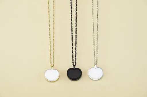 This image provided by Bond-Touch shows the Bond Heart smart necklace, which stores and plays heartbeats with the help of an app. Think outside the box for Mother's Day gifts this year. (Bond-Touch via AP).