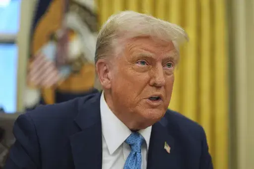President Donald Trump speaks to reporters as he signs executive orders in the Oval Office of the White House, Friday, Jan. 31, 2025, in Washington. (AP Photo/Evan Vucci)