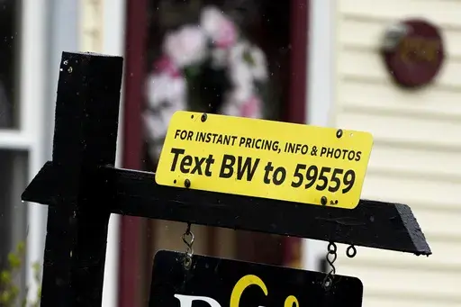 A sign is displayed outside a home in Wheeling, Ill., Thursday, May 5, 2022. Sometimes hosts offering to rent their vacation home, RV or car through peer-to-peer sharing sites don’t show up at the time they promised to exchange keys. If you can’t get in contact with them, you might have been “ghosted,” leaving you stranded. (AP Photo/Nam Y. Huh, File)
