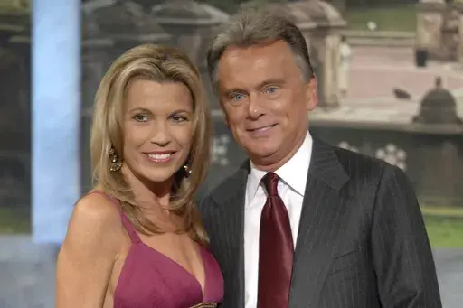 Vanna White, left, and Pat Sajak make an appearance at Radio City Music Hall for a taping of celebrity week on "Wheel of Fortune" in New York on Sept. 29, 2007. (AP Photo/Peter Kramer, file)