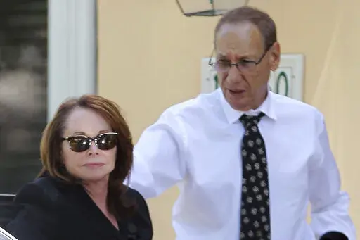 Shirley Sotloff and her husband, Arthur B. Sotloff, exit a car as they return home after a memorial service for their son, slain journalist Steven Sotloff, at Temple Beth Am, Friday, Sept. 5, 2014, in Pinecrest, Fla. The family of slain American journalist Steven Sotloff filed a federal lawsuit Friday, May 13, 2022, accusing prominent Qatari institutions of wiring $800,000 to an Islamic State “judge” who ordered the murder of Sotloff and another American journalist, James Foley. (Carl Juste/