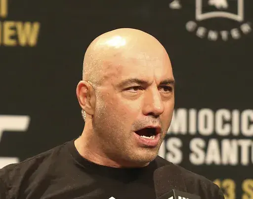 Joe Rogan is seen during a weigh-in before UFC 211 on Friday, May 12, 2017, in Dallas. Spotify has penned a new multi-year partnership deal with Rogan, Friday, Feb. 2, 2024. The enormously popular show will soon also be available on competing platforms, including YouTube and Apple Podcasts. ( AP Photo/Gregory Payan, File)