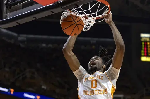 Tennessee forward Jonas Aidoo (0) dunks the ball during the first half of an NCAA college basketball game against Mississippi Saturday, Jan. 6, 2024, in Knoxville, Tenn. (AP Photo/Wade Payne)