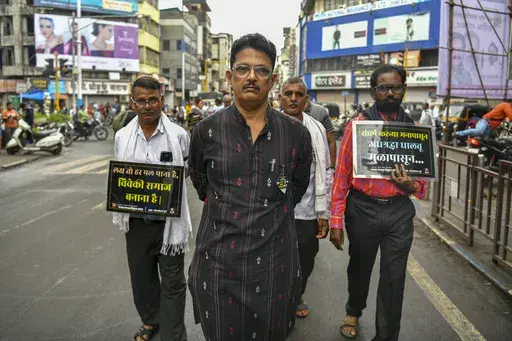 Avinash Patil, center, an activist and leader of the Maharashtra Andhashraddha Nirmulan Samiti, an anti-superstition group, marches on the 10th death anniversary of its founder and renowned rationalist, Narendra Dabholkar, who was gunned down during a morning walk in Pune, India, Sunday, Aug 20, 2023. The nones in India come from an array of belief backgrounds, including Hindu, Muslim and Sikh. The surge of Hindu nationalism has shrunk the space for the nones over the last decade, activists say.