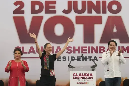 Ruling party presidential candidate Claudia Sheinbaum, center left, greets supporters at a campaign rally, flanked by mayoral candidate Clara Brugada and Morena party president Mario Delgado, in Mexico City, May 16, 2024. (AP Photo/Marco Ugarte, File)