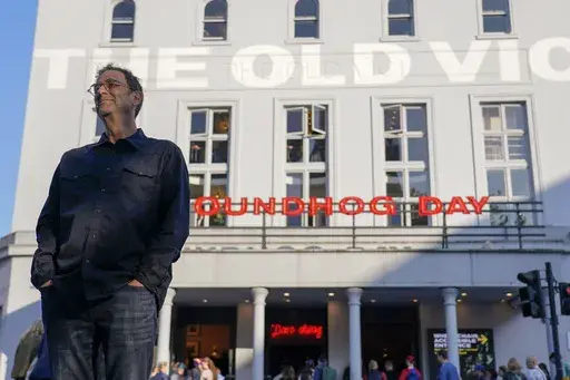 Screenwriter and playwright Danny Rubin poses outside the Old Vic Theatre, in London, Monday, June 5, 2023. “Groundhog Day” is back. Again. The story of a jaded weatherman fated to live the same day over and over began as a beloved movie, then became an award-winning stage musical. On Thursday, June 8 it opens at London’s Old Vic Theatre, seven years after its triumphant debut in the same venue. (AP Photo/Alberto Pezzali)