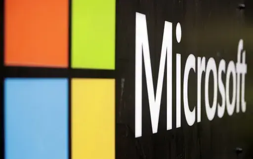 The Microsoft company logo is displayed at their offices in Sydney, Australia, on Feb. 3, 2021. Microsoft says the early June 2023 disruptions to its Microsoft’s flagship office suite — including the Outlook email and OneDrive file-sharing apps — were denial-of-service attacks by a shadowy new hacktivist group. (AP Photo/Rick Rycroft, File)