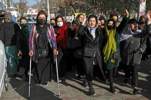 Afghan women chant slogans during a protest against the ban on university education for women, in Kabul, Afghanistan, Thursday, Dec. 22, 2022. The U.S. has condemned the Taliban for ordering non-governmental groups in Afghanistan to stop employing women, saying the ban will disrupt vital and life-saving assistance to millions. It is the latest blow to female rights and freedoms since the Taliban seized power last year and follows sweeping restrictions on education, employment, clothing and trave