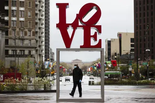 The Robert Indiana sculpture "LOVE" stands in John F. Kennedy Plaza, commonly known as Love Park, in Philadelphia, April 13, 2020. (AP Photo/Matt Rourke, File)